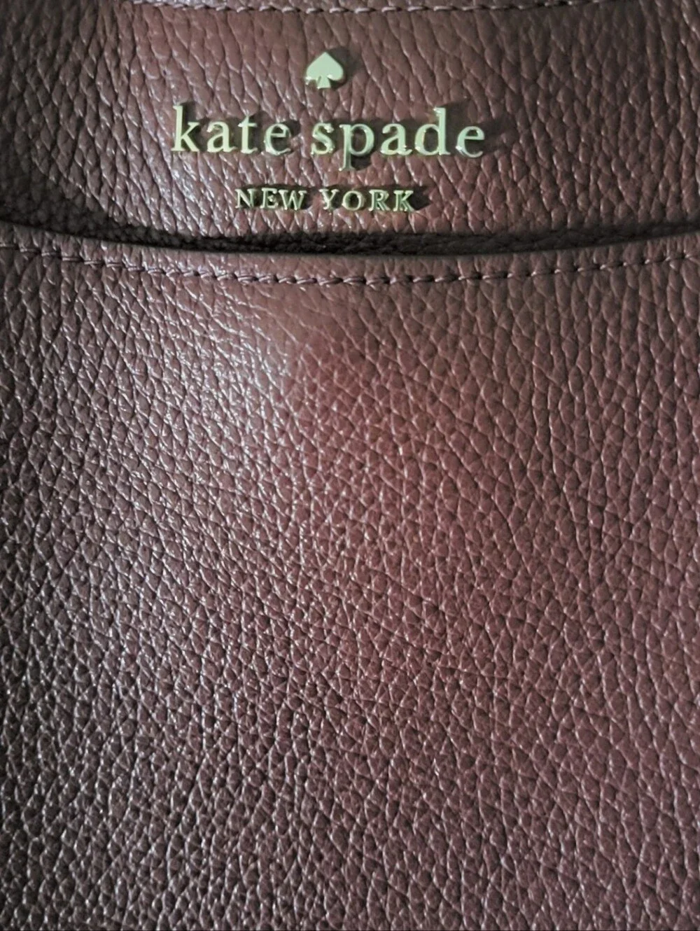 kate spade Burgundy pebbled leather crossbody bag with gold logo